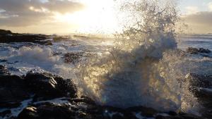 Wave crashing on rocks