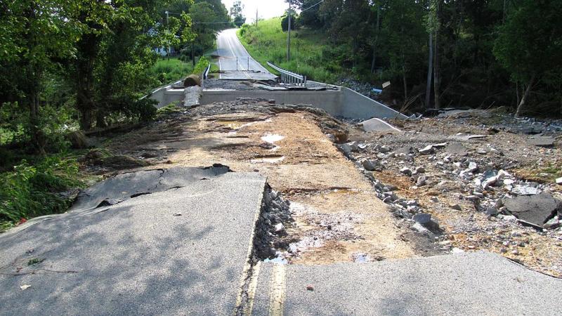 Photo of roadway washed out by flood