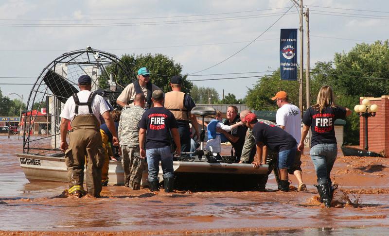 First responders gather flood victims on airboat